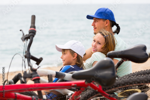 Parents and son with bicycles