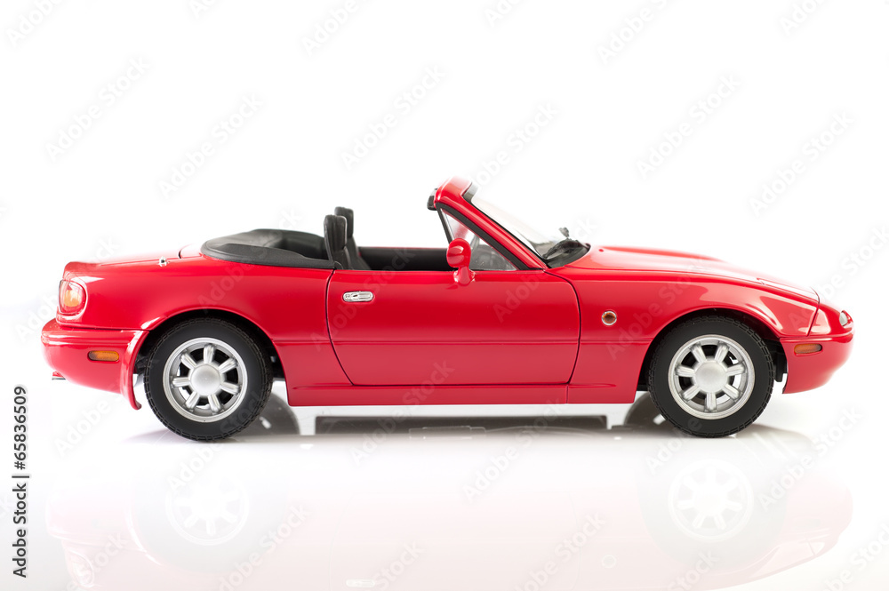 Red sport car model isolated on white background