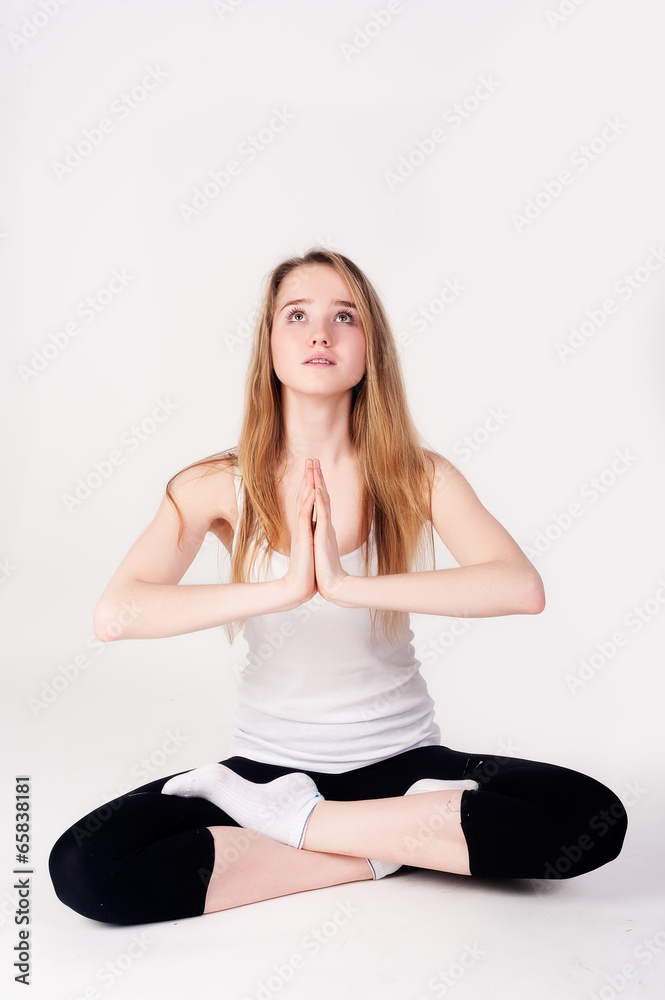 Pretty girl doing meditation exercise Pretty girl doing meditation exercise