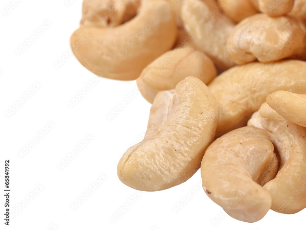 Heap of cashews on a white background