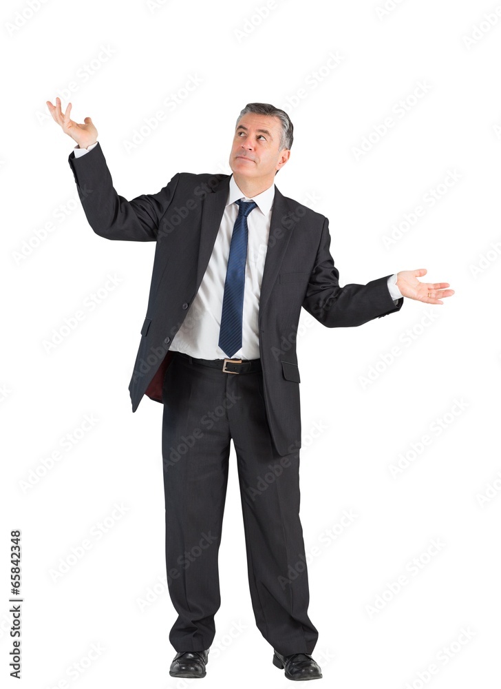 Mature businessman standing with arms out Mature businessman standing with arms out
