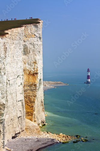 Tourists at the egde of the cliffs at Beachy Head photo