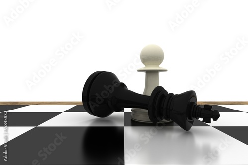 White pawn standing over fallen black king