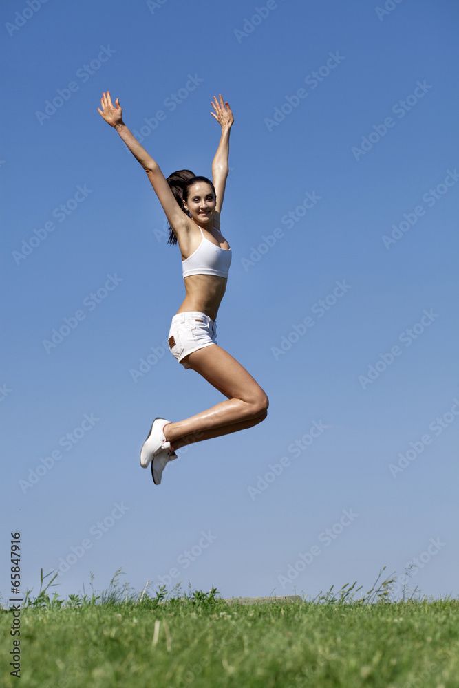 Fitness woman exercising in summer park Fitness woman exercising in summer park