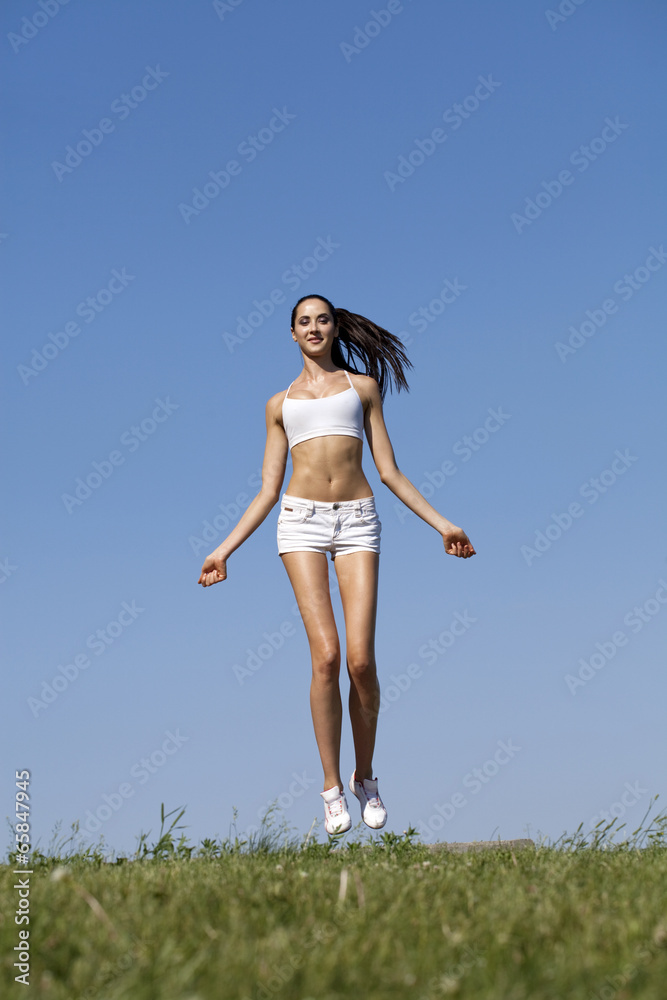 Fitness woman exercising in summer park Fitness woman exercising in summer park