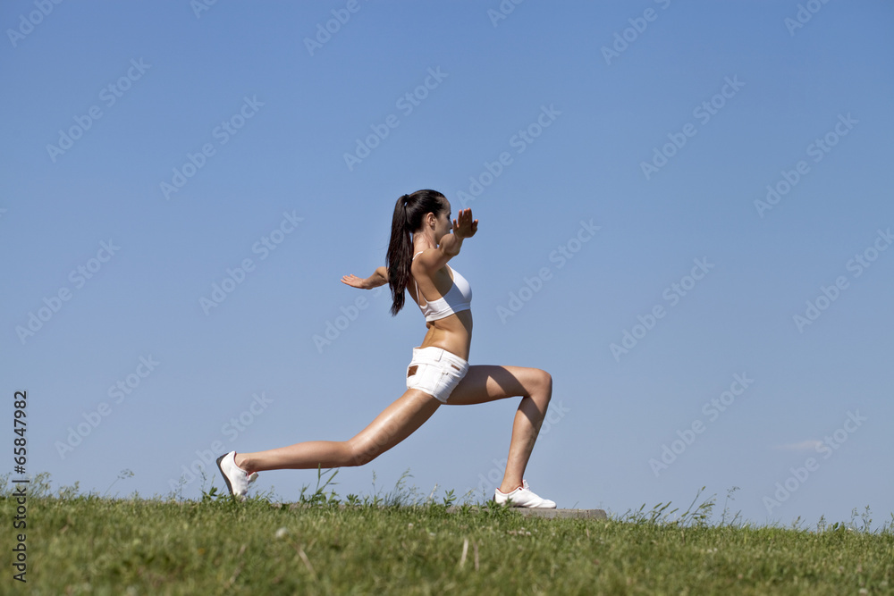 Fitness woman exercising in summer park Fitness woman exercising in summer park