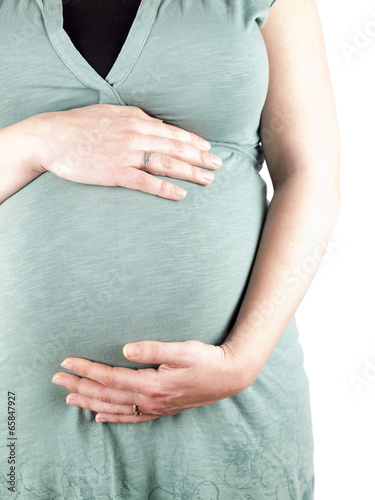36 weeks pregnant young woman holding her belly