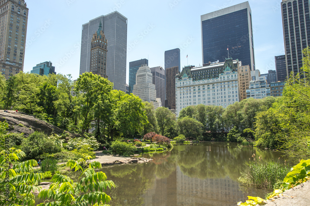 New York City Central Park pond and buildings New York City Central Park pond and buildings