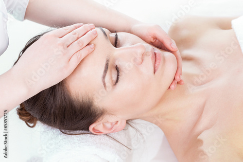 Woman having face massage