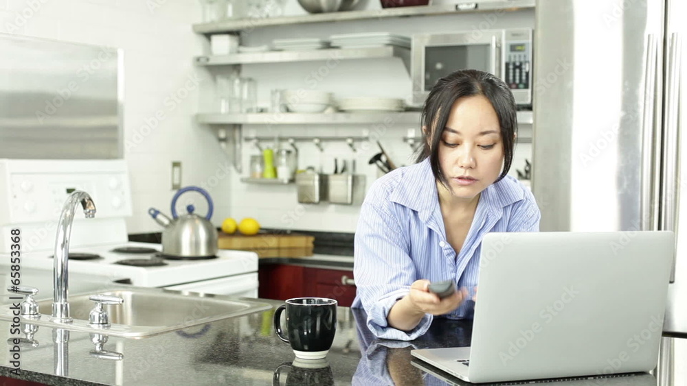 Asian girl in her kitchen Asian girl in her kitchen