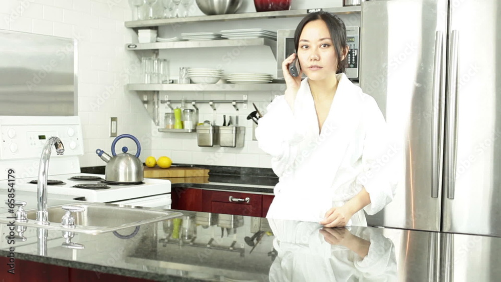 Asian girl in her kitchen Asian girl in her kitchen