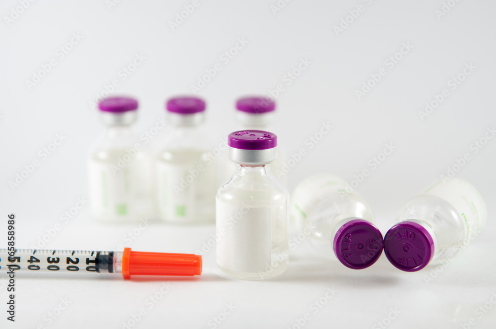 Purple cap injection vials and syringe show medicine concept Purple cap injection vials and syringe show medicine concept