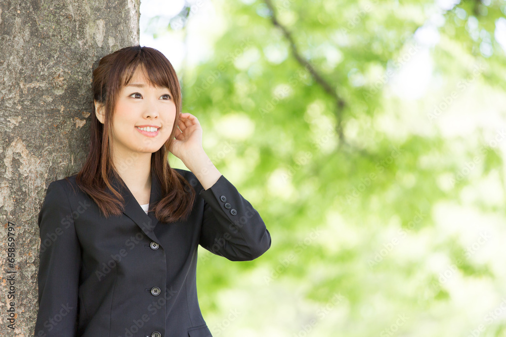 young asian woman on green background young asian woman on green background