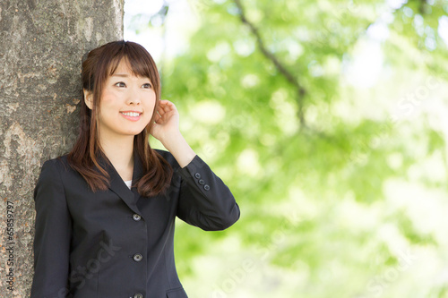 young asian woman on green background