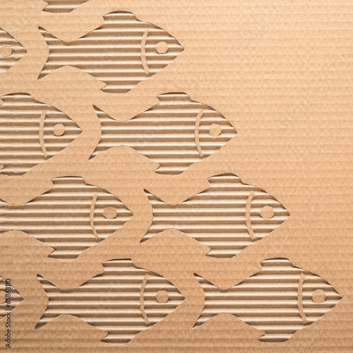 Fishes cut out on a corrugated cardboard