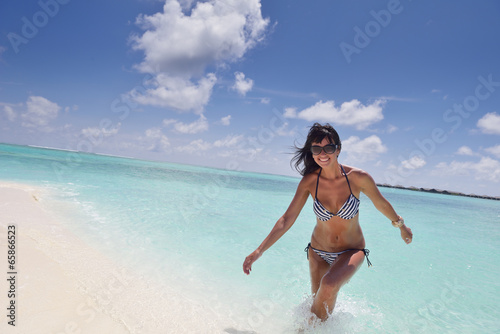 beautiful young woman on beach have fun and relax