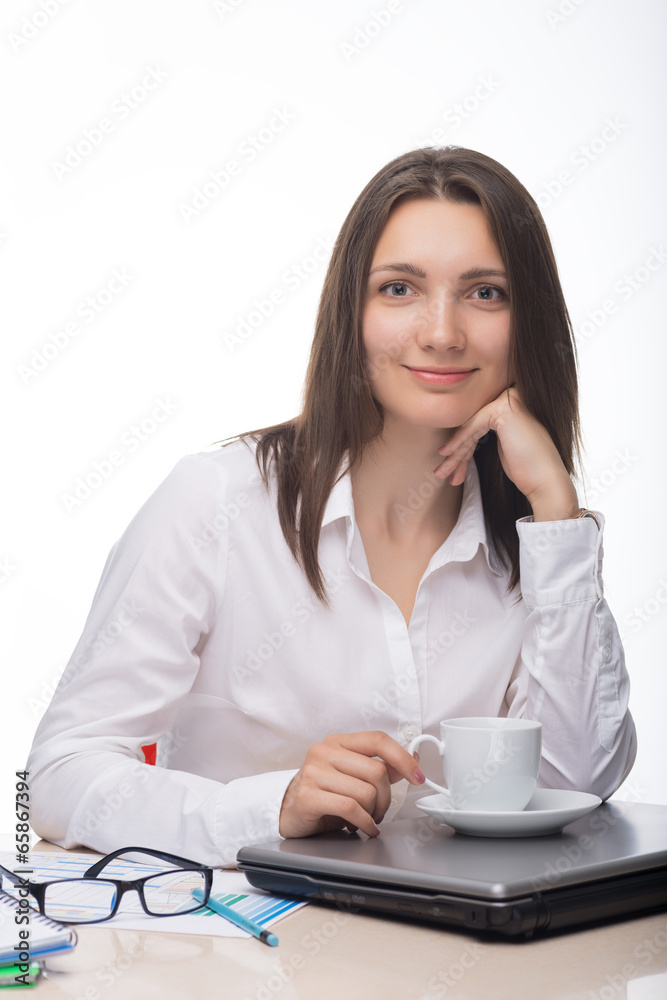Businesswoman working on her computer at the office Businesswoman working on her computer at the office