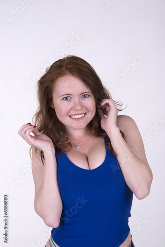 Portrait of a young woman wearing a blue vest