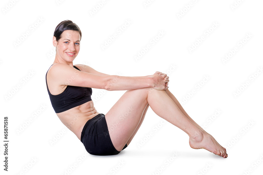 Healthy young woman exercising, isolated on white