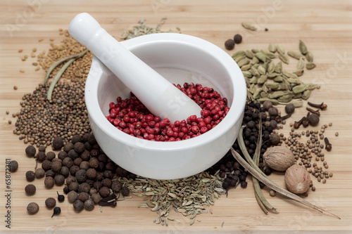 Fototapeta Naklejka Na Ścianę i Meble -  Mortar and pestle with spices on a wooden table