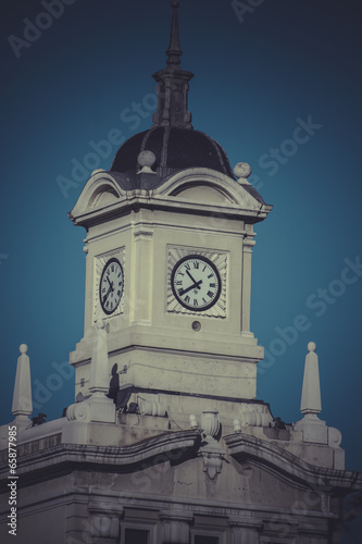 Old clock tower in Plaza de Colon, Madrid, Spain photo