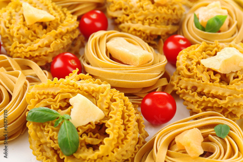 Raw homemade pasta and tomatoes, closeup