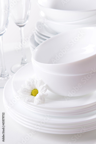 Set of white dishes close-up © Africa Studio