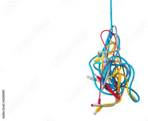 Cluster of chaotic tangled network cables isolated on white back