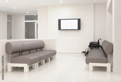 Hospital waiting room with empty chairs.
