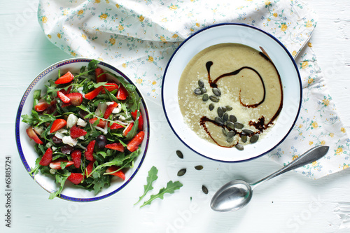 Arugula salad with strawberries and eggplant creamy soup