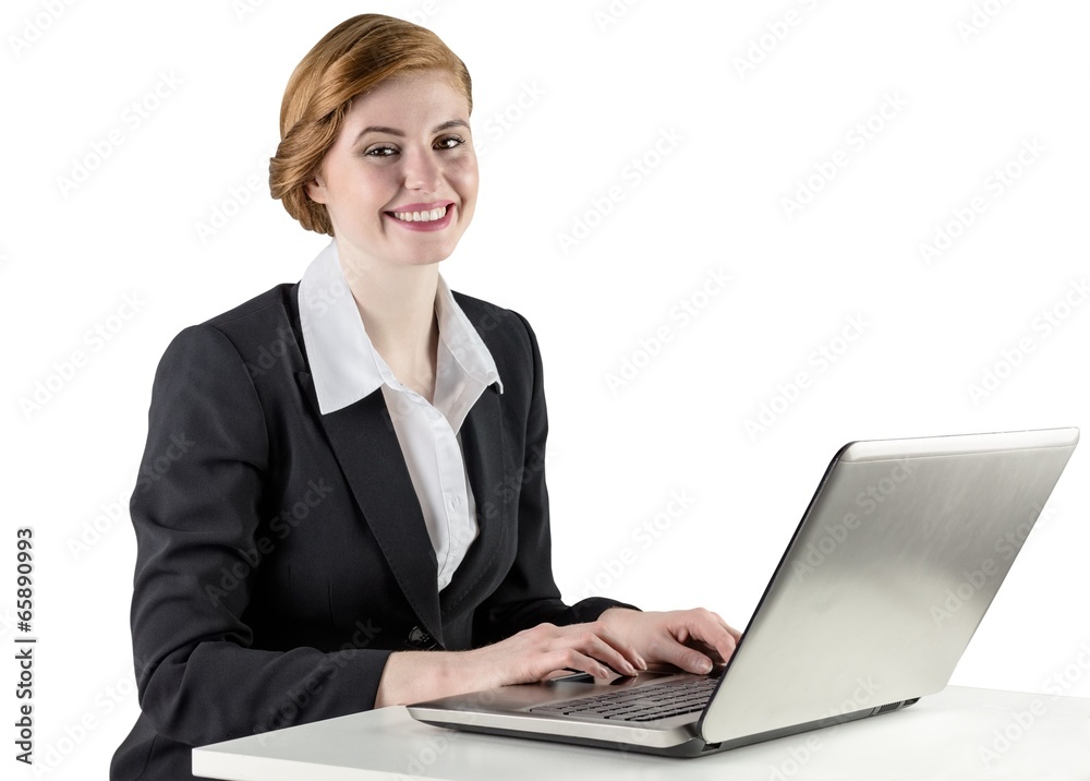 Redhead businesswoman using her laptop Redhead businesswoman using her laptop