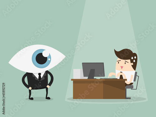 Manager overseeing businessman working on computer at the office
