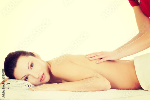 Preaty woman relaxing beeing massaged in spa