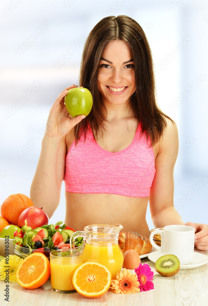 Young woman having breakfast. Balanced diet Young woman having breakfast. Balanced diet