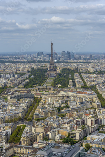 Aerial view of Eiffel Tower and La Defense business district tak