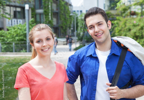 Portrait of two students on campus