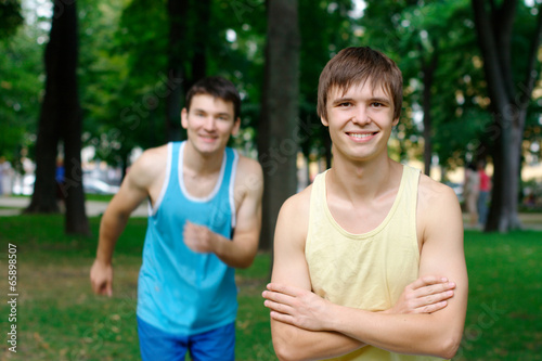 Two young man jogging at the park