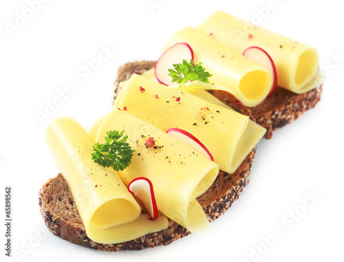 Cuadro en lienzo Rolled gouda cheese on a wholewheat sandwich