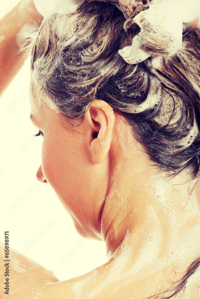 Naklejka premium Beautiful woman taking a shower