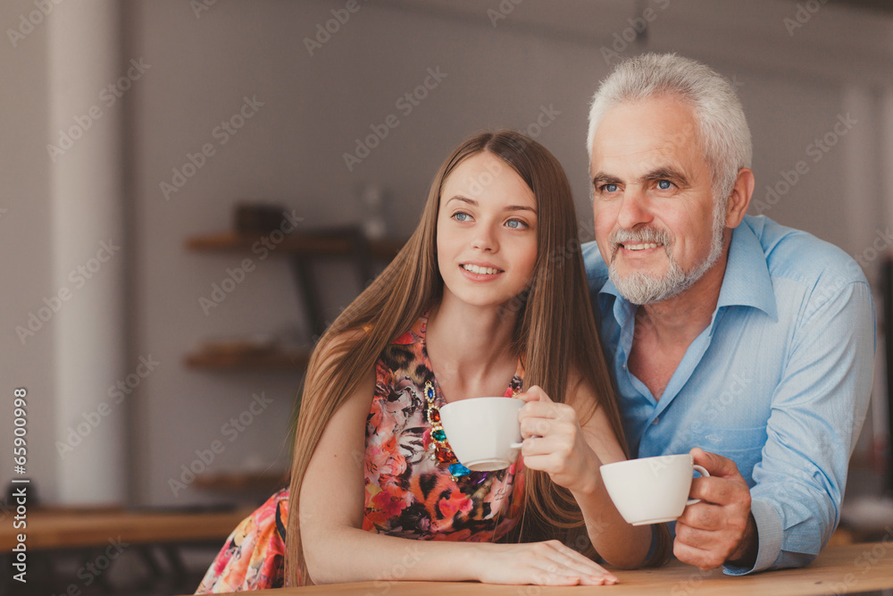 senior man with drinking cofee with beautiful woman senior man with drinking cofee with beautiful woman