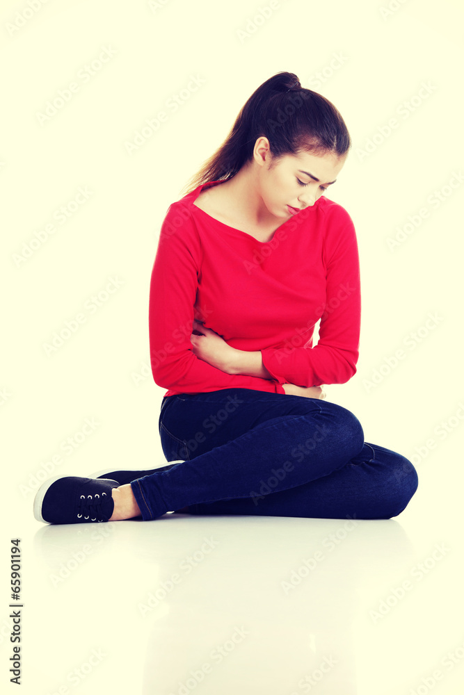 Obraz premium Young woman with stomach issues