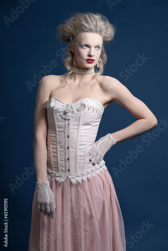 Retro classic baroque ballet fashion woman wearing pink corset a