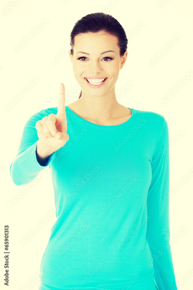 beautiful casual woman with pointing finger. beautiful casual woman with pointing finger.