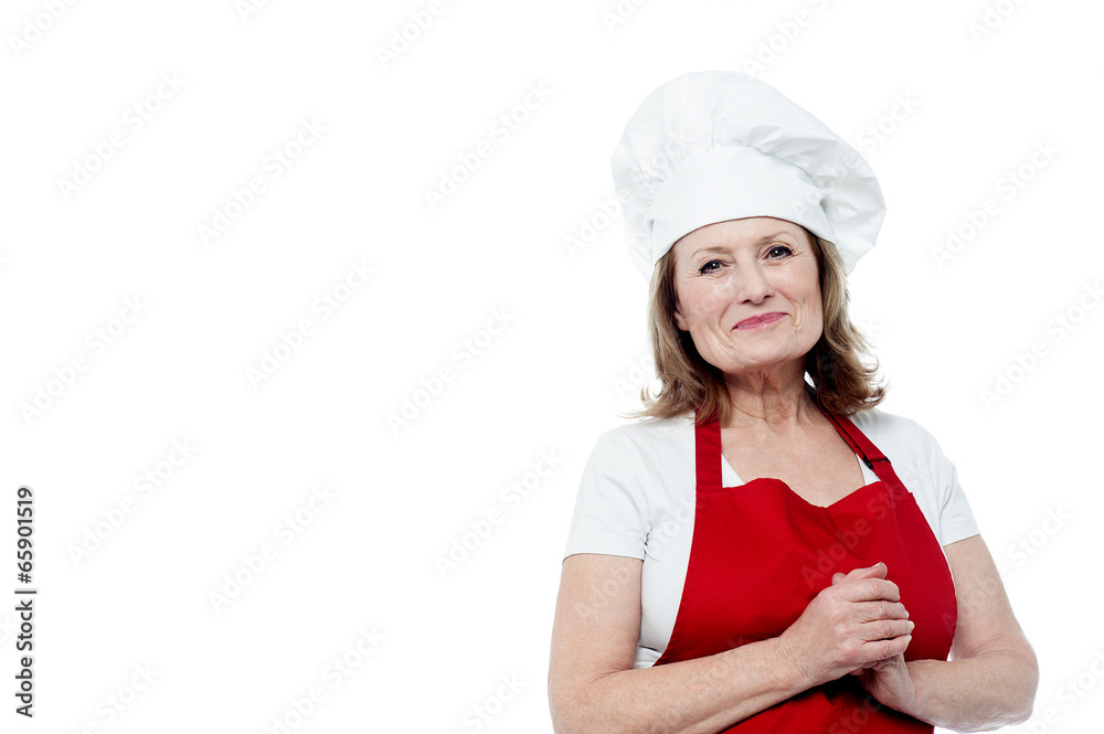 Portrait of a smiling female chef, hands clasped Portrait of a smiling female chef, hands clasped