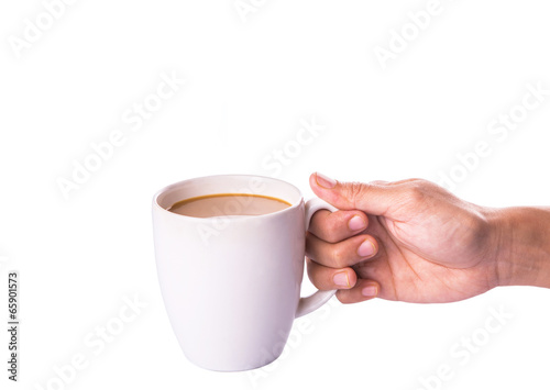 Woman hand holding a mug of coffee with creamer 