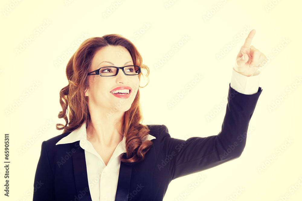 Attractive smiling businesswoman making choose Attractive smiling businesswoman making choose
