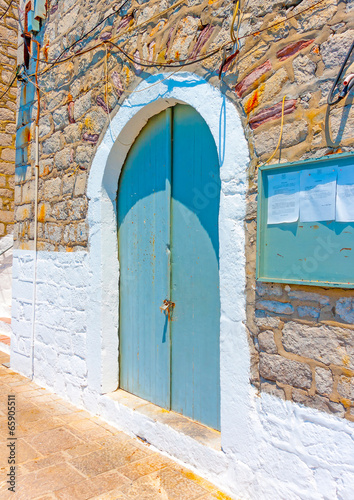 Beautiful door of an old house in Hydra island in Greece photo