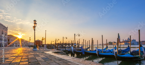 View of Venice with gondolas at sunrise