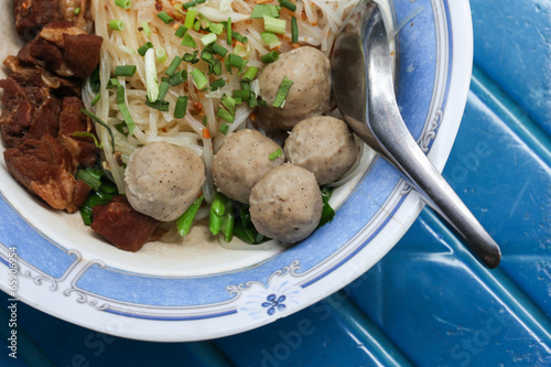 noodles and meatball in bolw photo