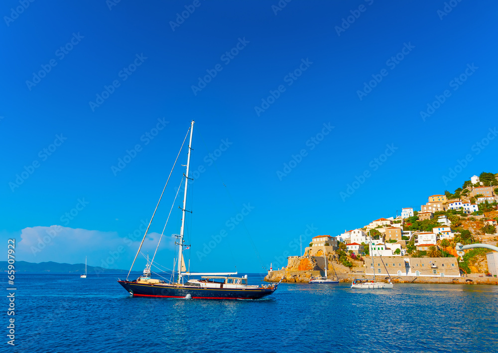 beautiful sailing yacht in the port of Hydra island in Greece beautiful sailing yacht in the port of Hydra island in Greece